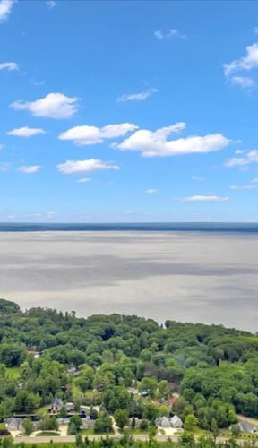 Wide aerial view of open water on a Michigan lake