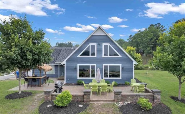 Aerial view of Houghton Lake Getaway with pontoon boat docked at the waterfront